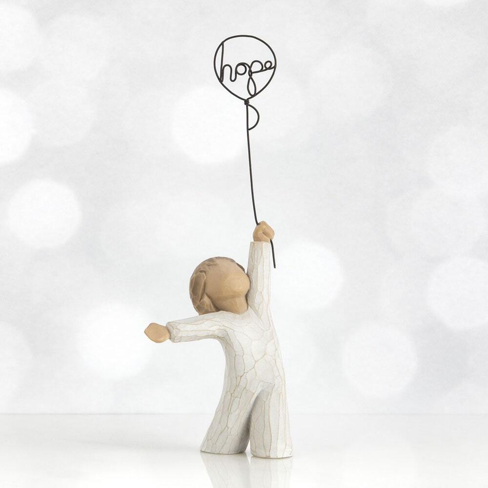 Hope by Willow Tree. Standing figure in cream onesie, holding wire balloon with the word 'hope' written in wire inside it