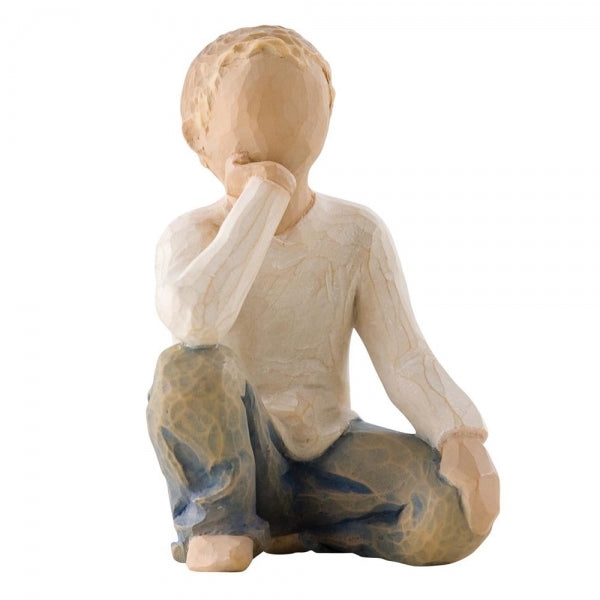 Figure of half-kneeling boy in cream shirt and blue jeans, with hand under chin