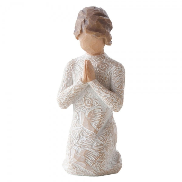 Kneeling female figure in cream dress with hands in prayer pose. Dress is heavily carved with birds and flowers